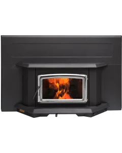 Pacific Energy Summit LE wood stove insert with blower in brushed nickel finish, installed in a masonry fireplace with bright flames through large glass window.
