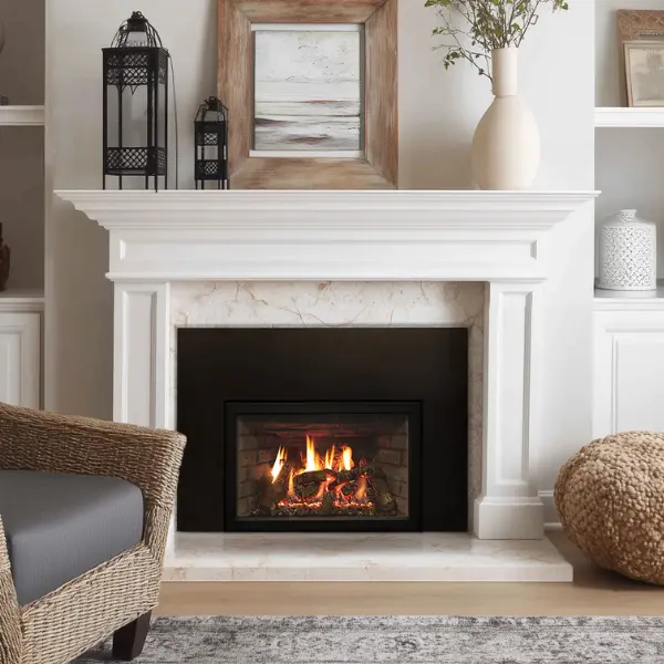 Empire Rushmore direct vent gas fireplace insert installed in a traditional white mantel fireplace