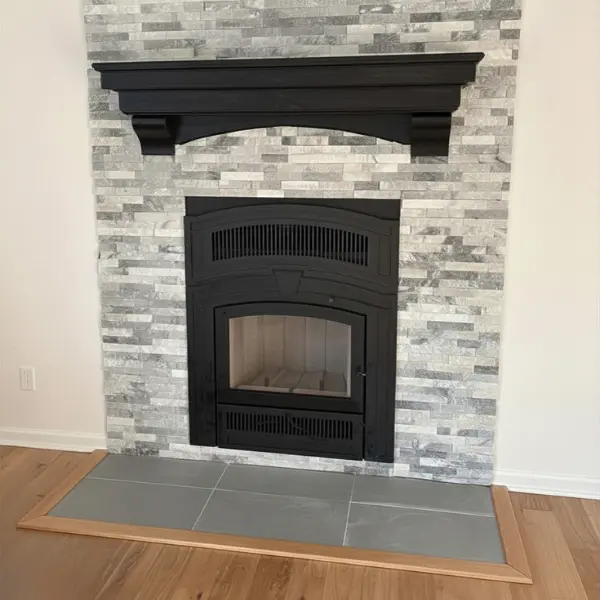 RSF Opel Keystone high efficiency wood burning fireplace installation in Virginia Beach VA with custom stone surround and floating mantel