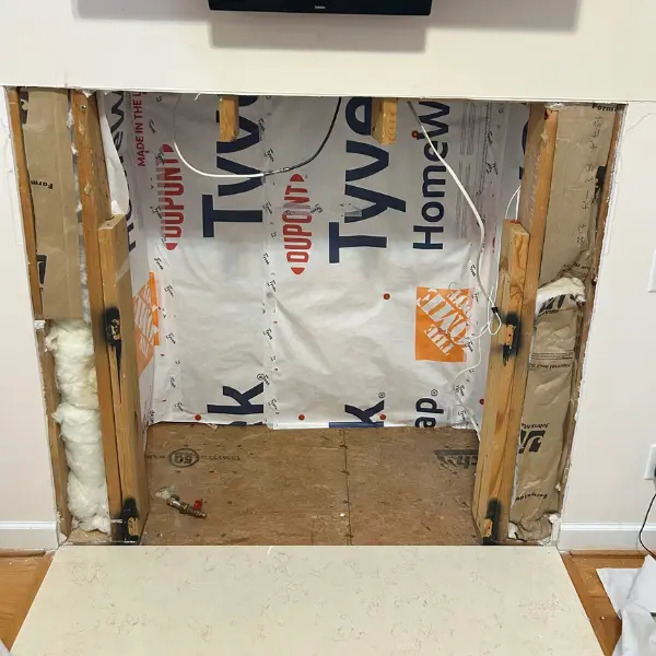 Existing fireplace wall opened for direct vent gas fireplace replacement and installation in Virginia Beach VA