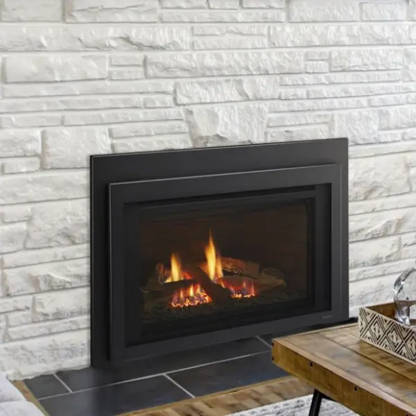 Majestic Jasper direct vent gas fireplace insert installed in a white masonry fireplace