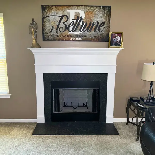 Wood burning fireplace replacement in Virginia Beach VA with custom white mantel black granite surround and hearth